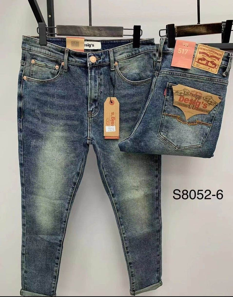 Close-up distressed details on blue denim jeans UAE - 3815 